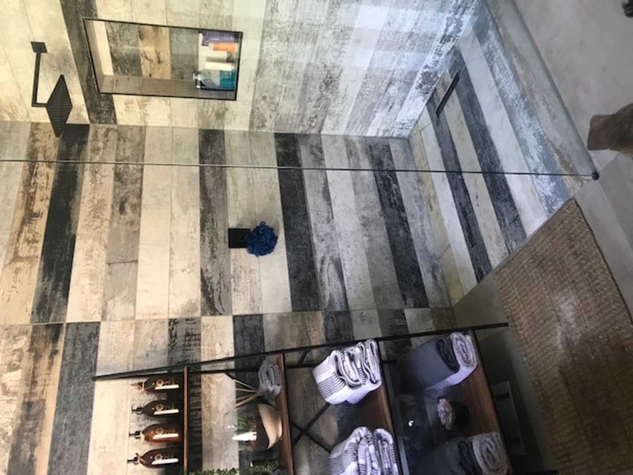 Designer powder room renovation with modern vessel sink